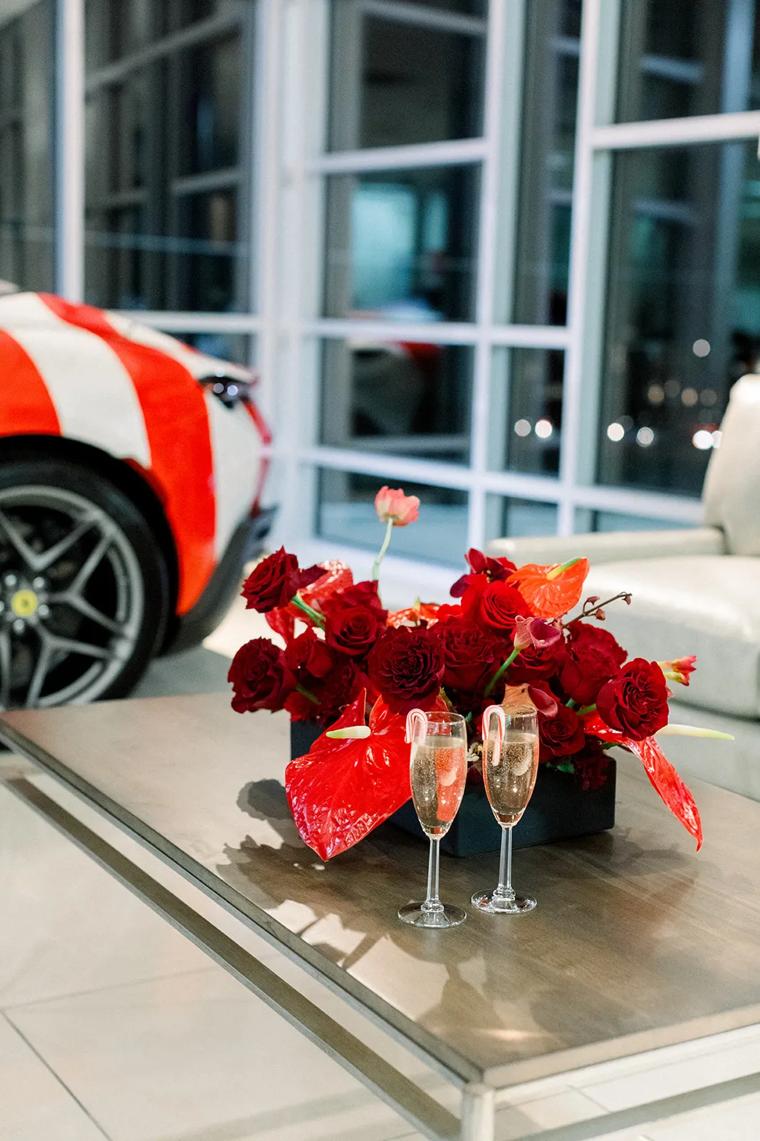 Ferrari of Denver holiday party red rose and anthurium arrangement