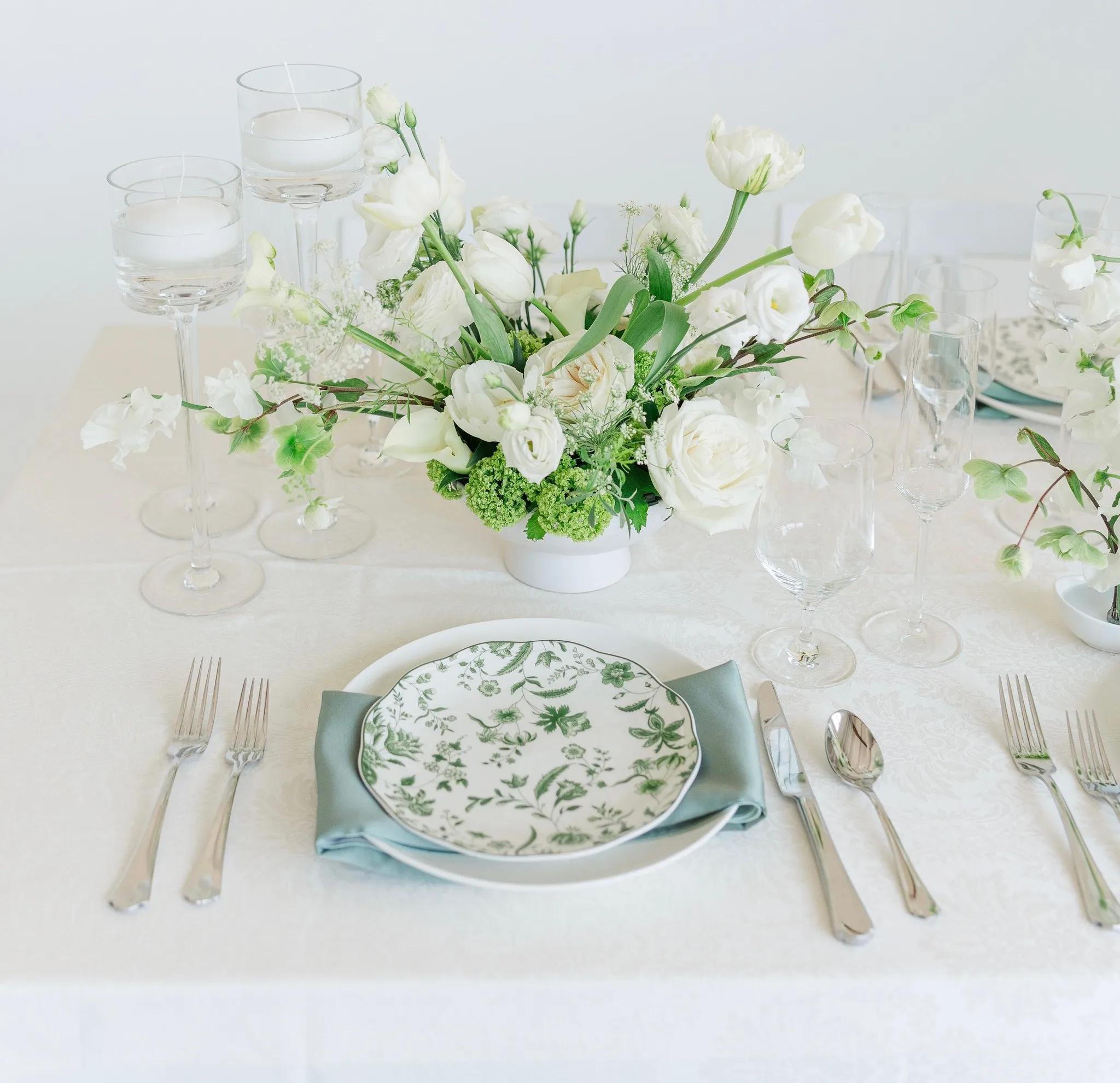 Minimalist frog arrangement with chartreuse blooms at Realm Denver
