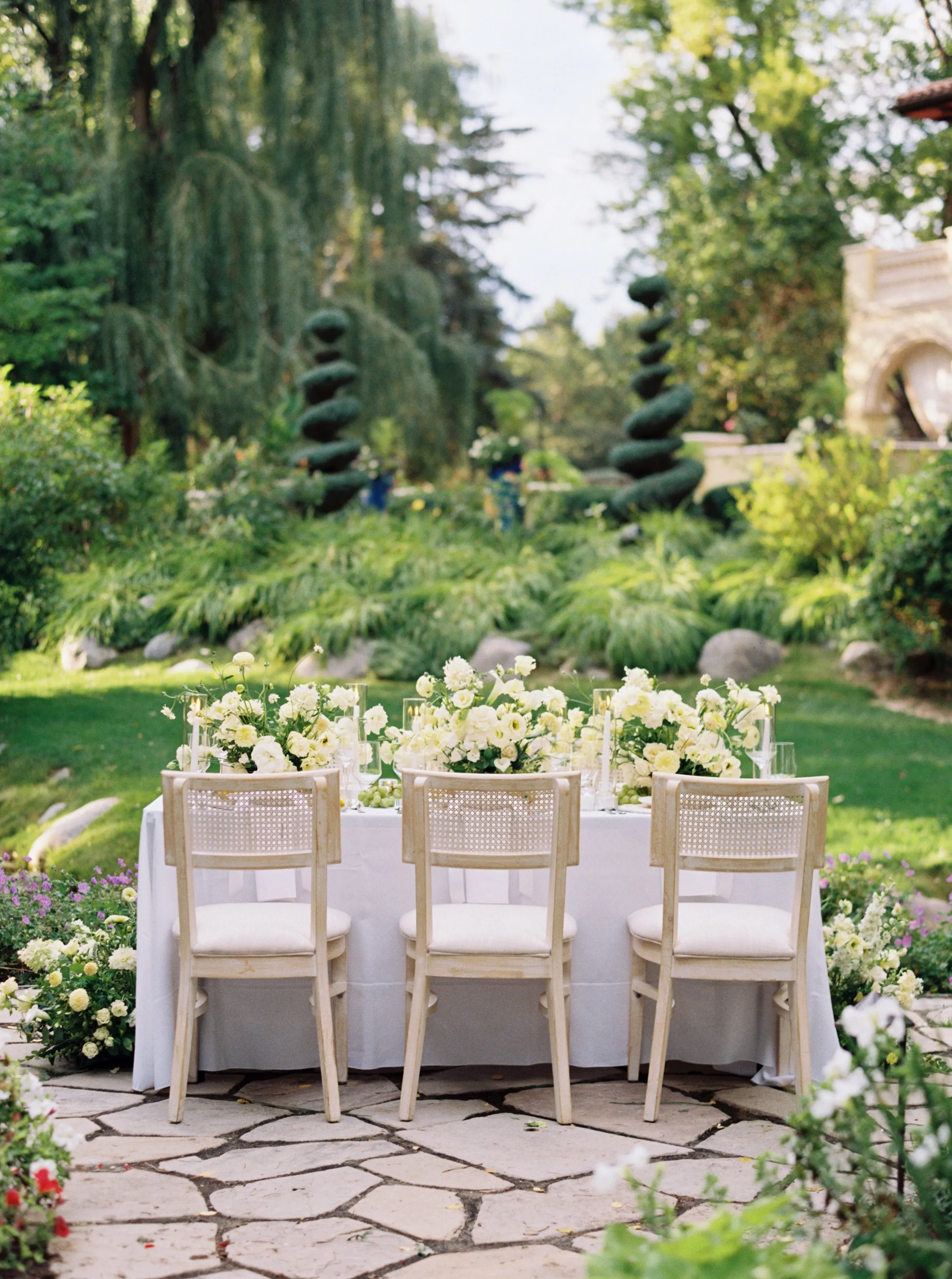 Oceana's Gardens outdoor celebration table with garden sculptures
