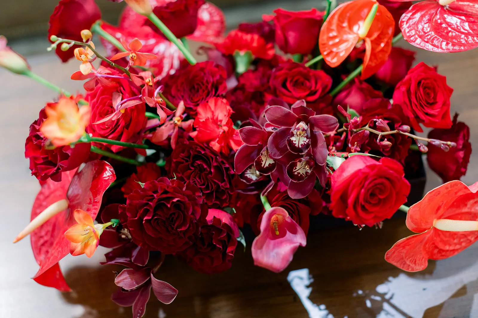 Sculptural red rose centerpiece at Ferrari of Denver