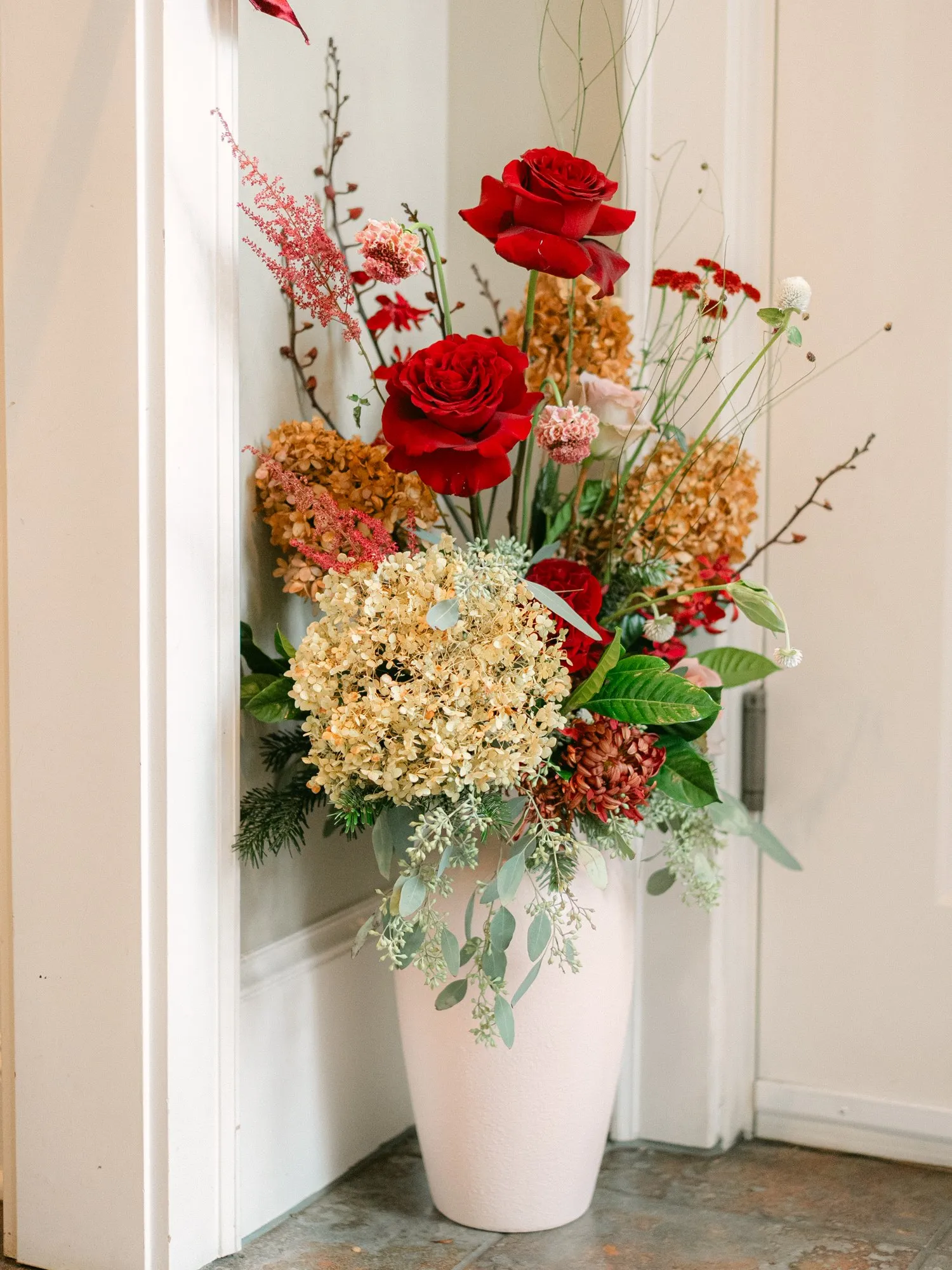 Interior holiday floral display at the home tour