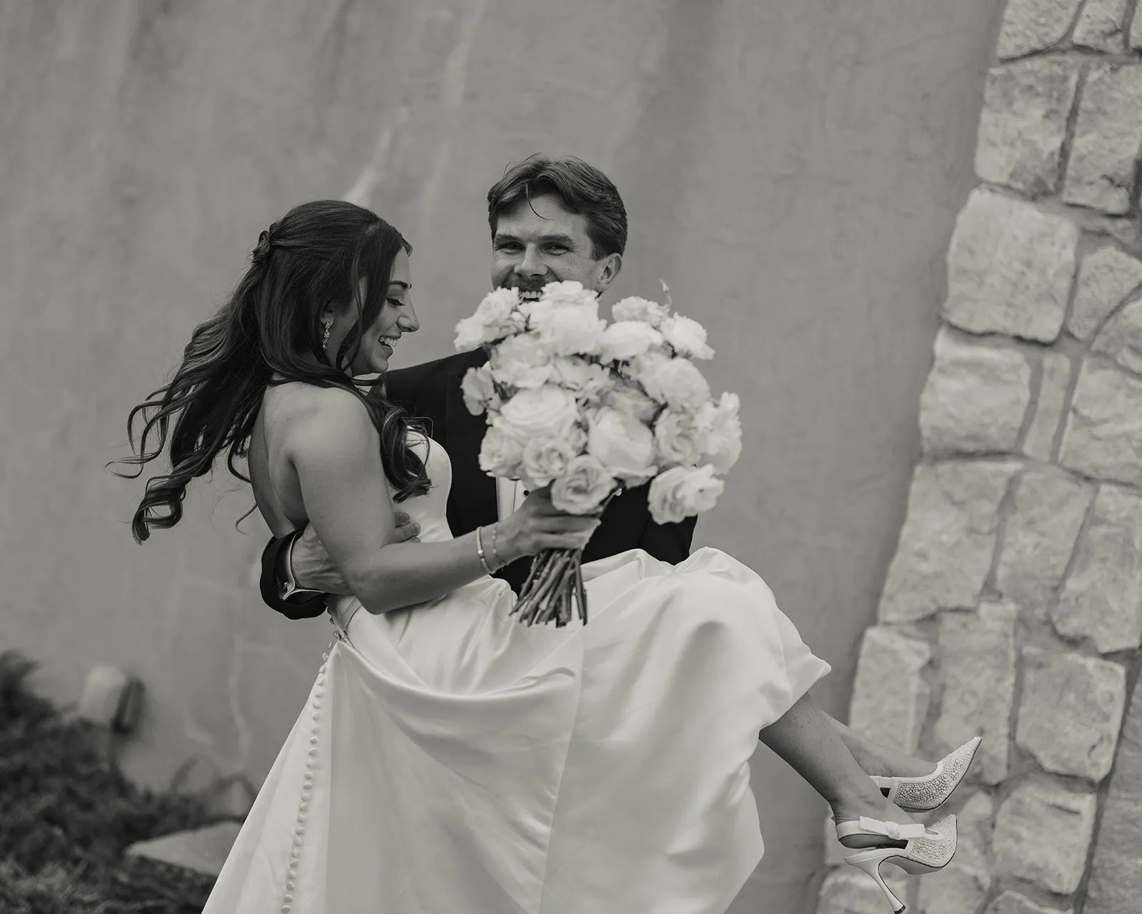 Bride and groom indoor portrait, smiling