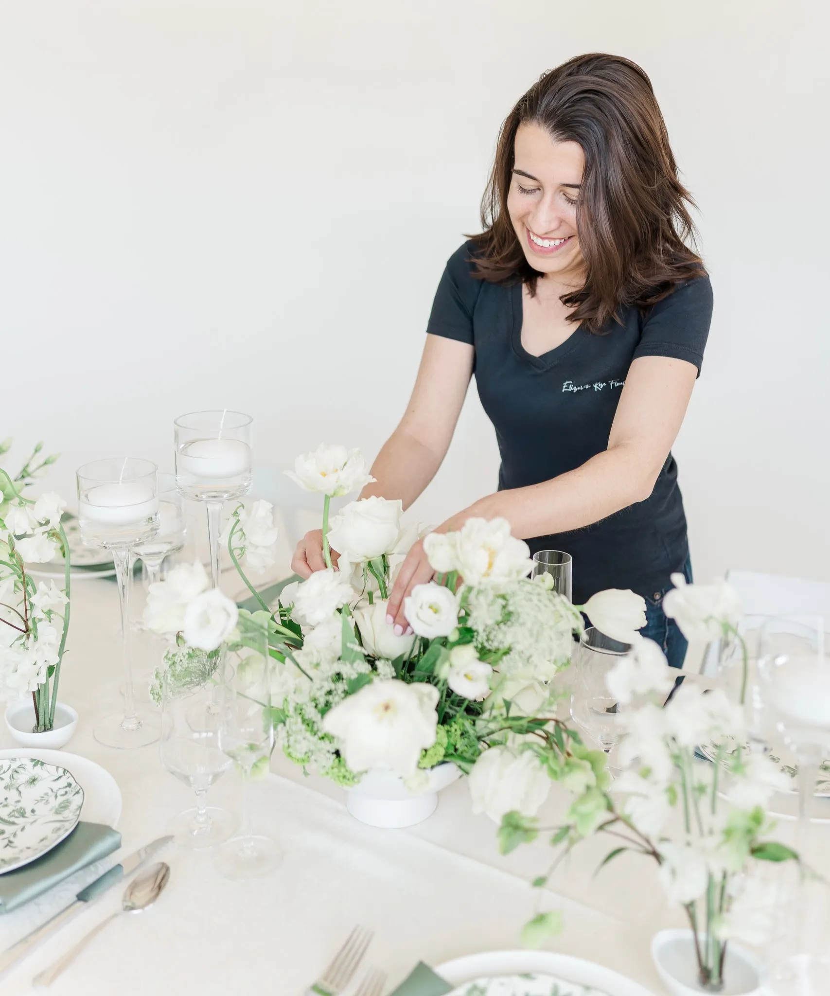 Florist arranging white flowers