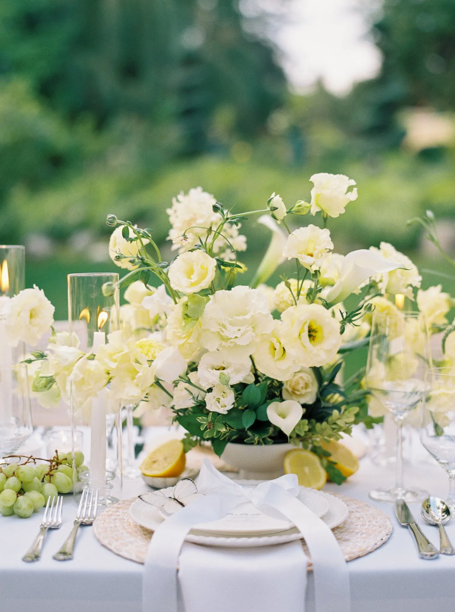 Oceana's Gardens white and lemon floral centerpiece with candles