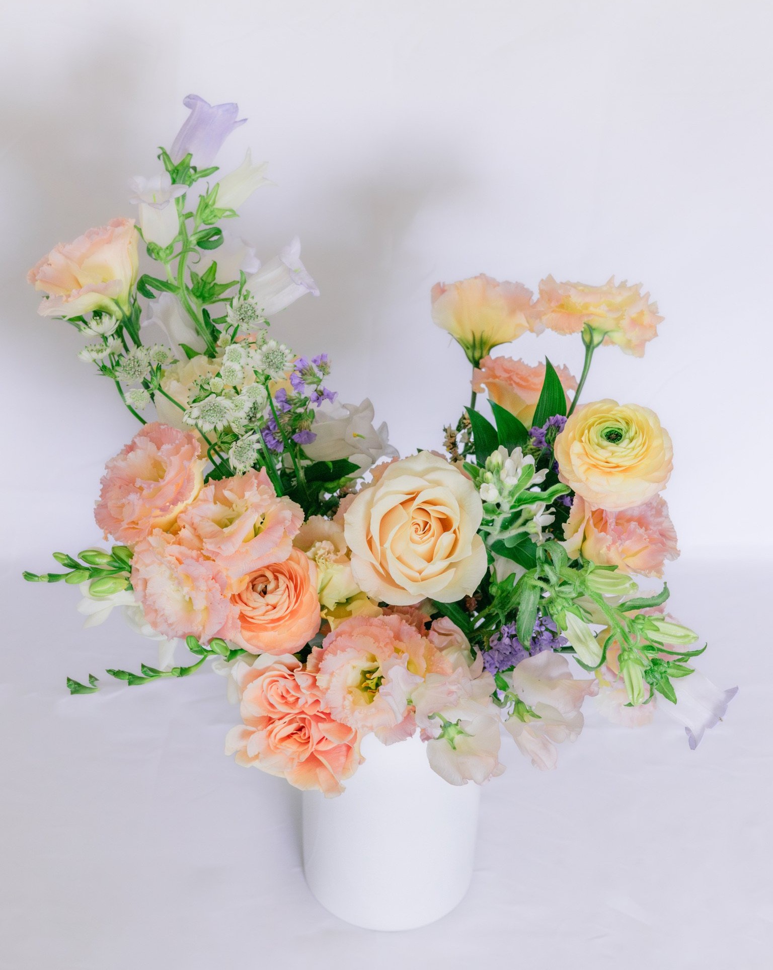 Celebration Bouquet with vibrant red, orange, and yellow florals